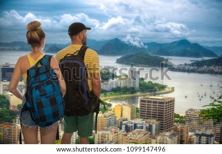 man with a woman traveling by RIO, Brazil