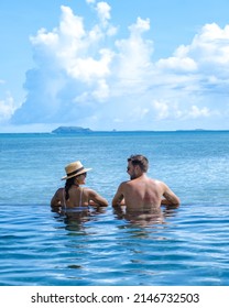 Man And Woman At A Tropical Pool, Couple Man And Woman At Swimming Pool In Mauritius. 