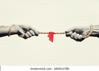 A man and a woman are tug of war. Concept. Black and white.