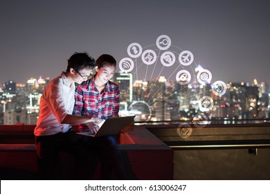 A Man And Woman Using Laptop With IOT, Internet Of Things Conceptual Sign, Internet Era, Internet In Every Day Lifes