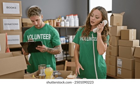 Man and woman volunteers organize donations indoors, engaged in activism, surrounded by boxes in a center. - Powered by Shutterstock