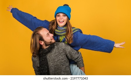 Man And Woman In Warm Clothing. Happy Boyfriend And Smiling Girlfriend In Sweater And Wool Scarf.