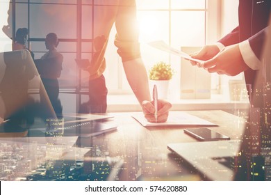 man and woman working in the office. collaborative teamwork. - Shutterstock ID 574620880