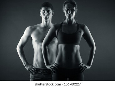 Man and woman's torso isolated on a black background - Powered by Shutterstock