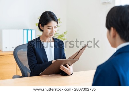 A man in work clothes and an interviewer