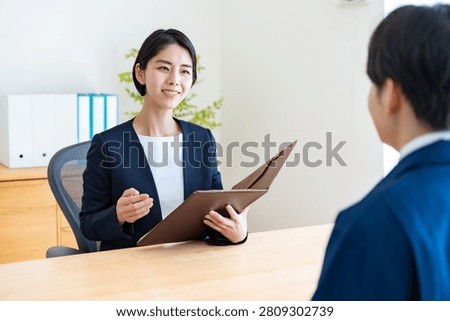A man in work clothes and an interviewer