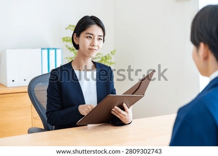 A man in work clothes and an interviewer