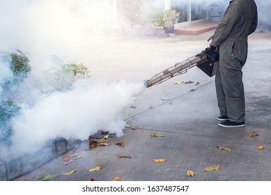 Man Work Fogging To Eliminate Mosquito For Preventing Spread Dengue Fever