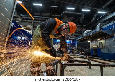 Man Work In Home Workshop Garage With Angle Grinder, Goggles And Construction Gloves, Sanding Metal Makes Sparks Closeup, Diy And Craft Concept