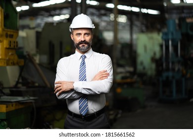 Man at work. Mechanical Engineer Bearded man in Hard Hat  in Heavy Industry Manufacturing Facility. Professional Engineer Operating lathe Machinery - Shutterstock ID 1815661562