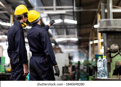 Man at work. Mechanical Engineer man in Hard Hat Wearing Safety

Jacket working in Heavy Industry Manufacturing Facility. Professional Engineer Operating lathe Machinery - Powered by Shutterstock