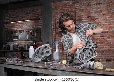 Man Work With The Socket Wrench, Repair And Cleaning Engine Parts On The Workbench In Home Garage Workshop, Diy Concept