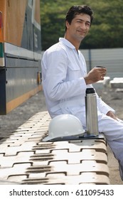 Man in work uniform taking a break