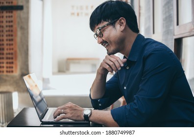 man work using computer hand typing laptop keyboard contact us online chatting search form internet sitting at office.concept for technology device communication business people