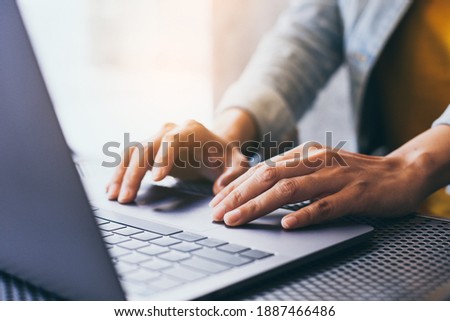 man work using computer hand typing laptop keyboard contact us online chatting search form internet sitting at office.concept for technology device communication business people