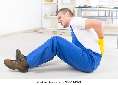 Man Worker With Back Injury, Concept Of Accident At Work