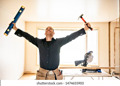 A man worker in the carpenter workroom renovation