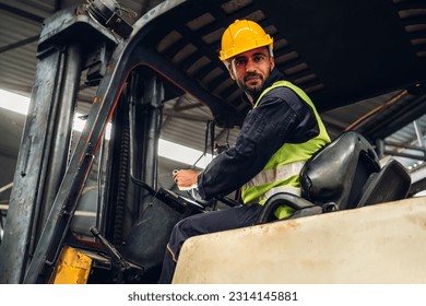 Man worker at forklift driver happy working in industry factory logistic ship. Man forklift driver in warehouse area.	Forklift driver sitting in vehicle in warehouse - Powered by Shutterstock