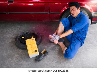 Man Worker With Toe Injury In Garage,
Concept Of Accident At Work