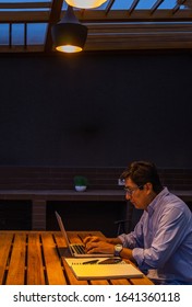 Man Working Alone At Night