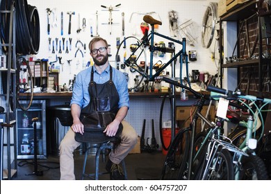 A man working in a bicycle repair shop