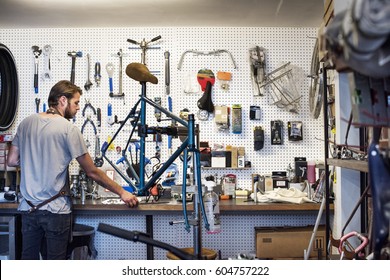 A Man Working In A Bicycle Repair Shop