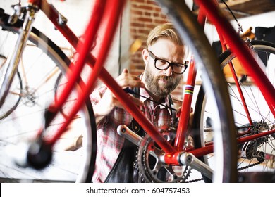 A man working in a bicycle repair shop