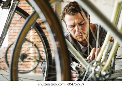 A man working in a bicycle repair shop