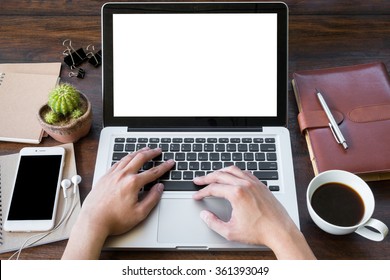 A Man Is Working By Using A Laptop Computer On Vintage Wooden Table. Hand Typing On A Keyboard. Front View.