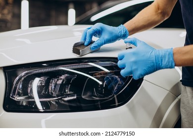 Man working car detailing and coating car