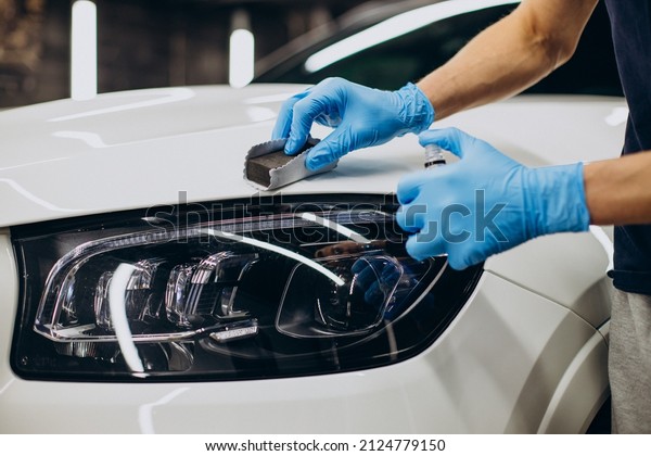 Man working car\
detailing and coating car