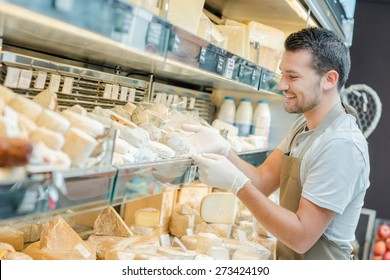 Man Working In A Cheese Shop