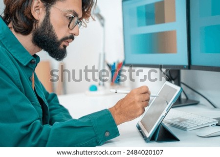 Man working with computer digital tablet at modern office. High quality photo