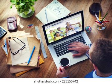 Man Working with Computer Life Insurance - Powered by Shutterstock