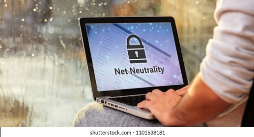 Man working with a computer, net neutrality text and a lock on the screen, copy space