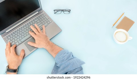 Man Working At Computer On Blue Background. Online Work And Education Concept.