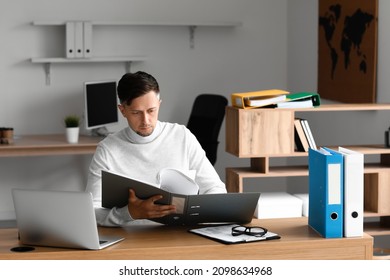Man working with documents in office