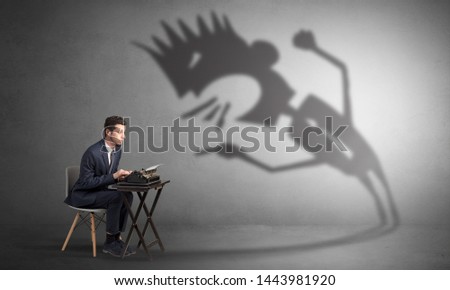 Man working hard and he is afraid of a yelling shadow
