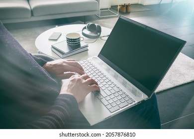 A Man Is Working At Home During Coronavirus Pandemic.Home Office Concept.