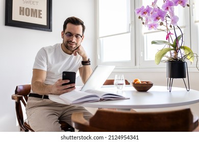 Man Working At Home Using Laptop.