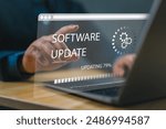 Man working and installing update process. Software updates or operating system upgrades to keep your device up to date with enhanced functionality in new versions and improved security.