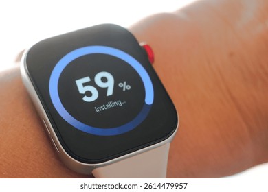 Man working and Installing update process with gearbox percentage progress and loading bar on smart watch