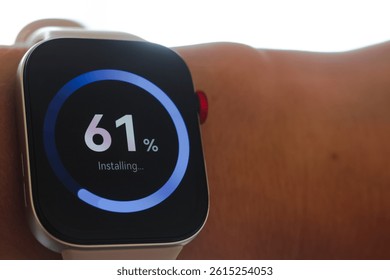 Man working and Installing update process with gearbox percentage progress and loading bar on smart watch
