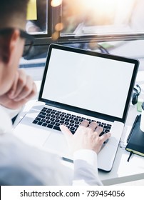 Man Working With Laptop. Mock-up Of The Screen.