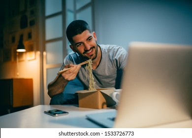 Man Working Late Eating Chinese Food At His Home