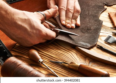 Man Working With Leather Using Crafting DIY Tools 