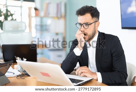 Man working in office, manager using laptop in work. Regional representative office company, carsharing, hiring staff.
