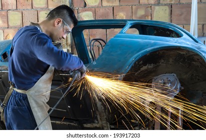 Man Working On Car Body