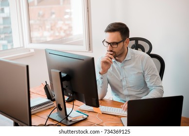 Man Working On Computer In Modern Office Interior. 