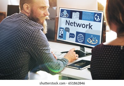 Man working on computer network graphic overlay